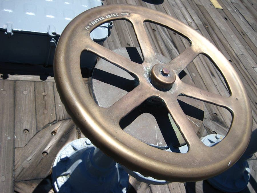 A heavy brass valve body of the kind used in high-volume water-powered pumps