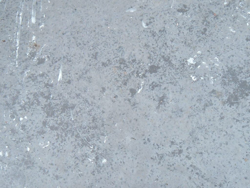 A wet patch on a concrete basement floor