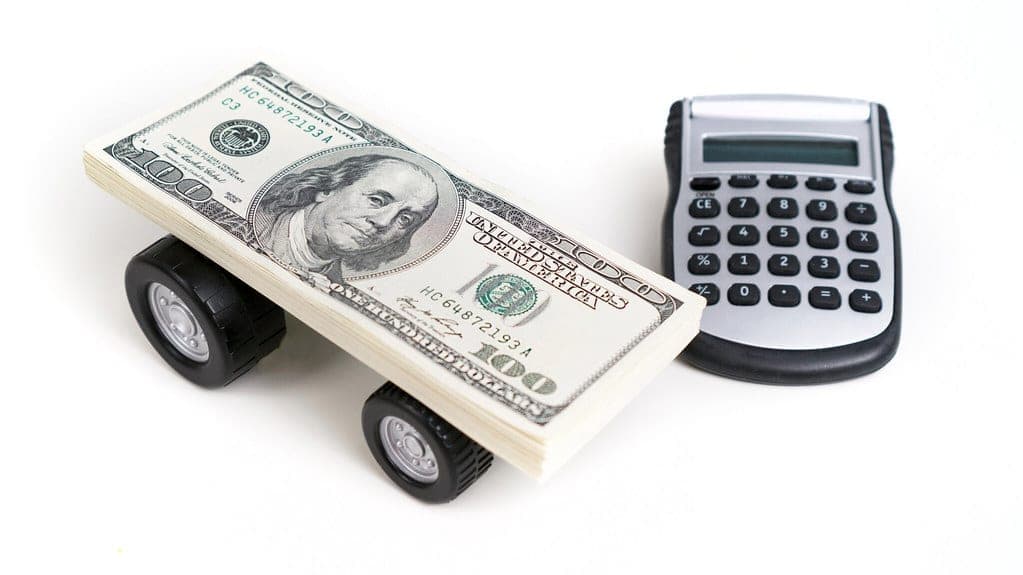 A calculator and paperwork on a desk