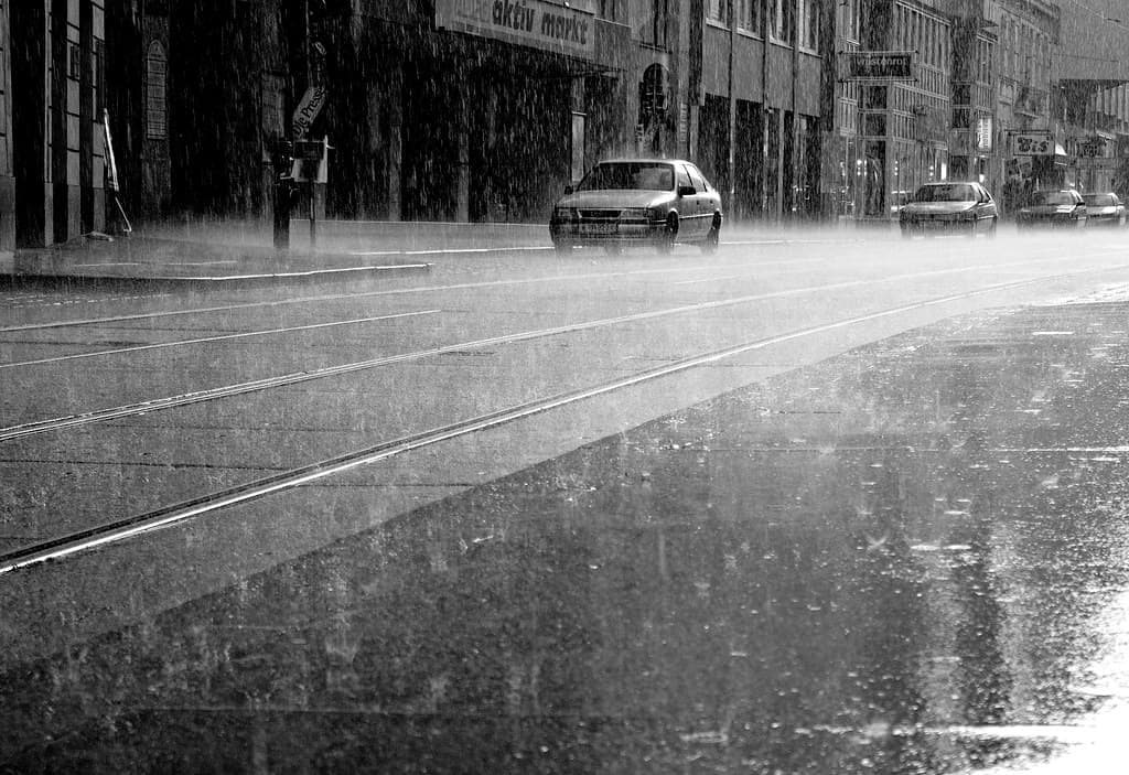 Heavy rain falling on a residential street