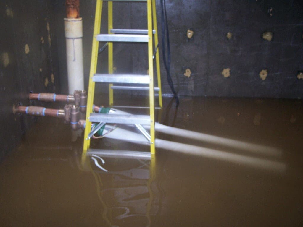 A submersible pump on a workshop floor